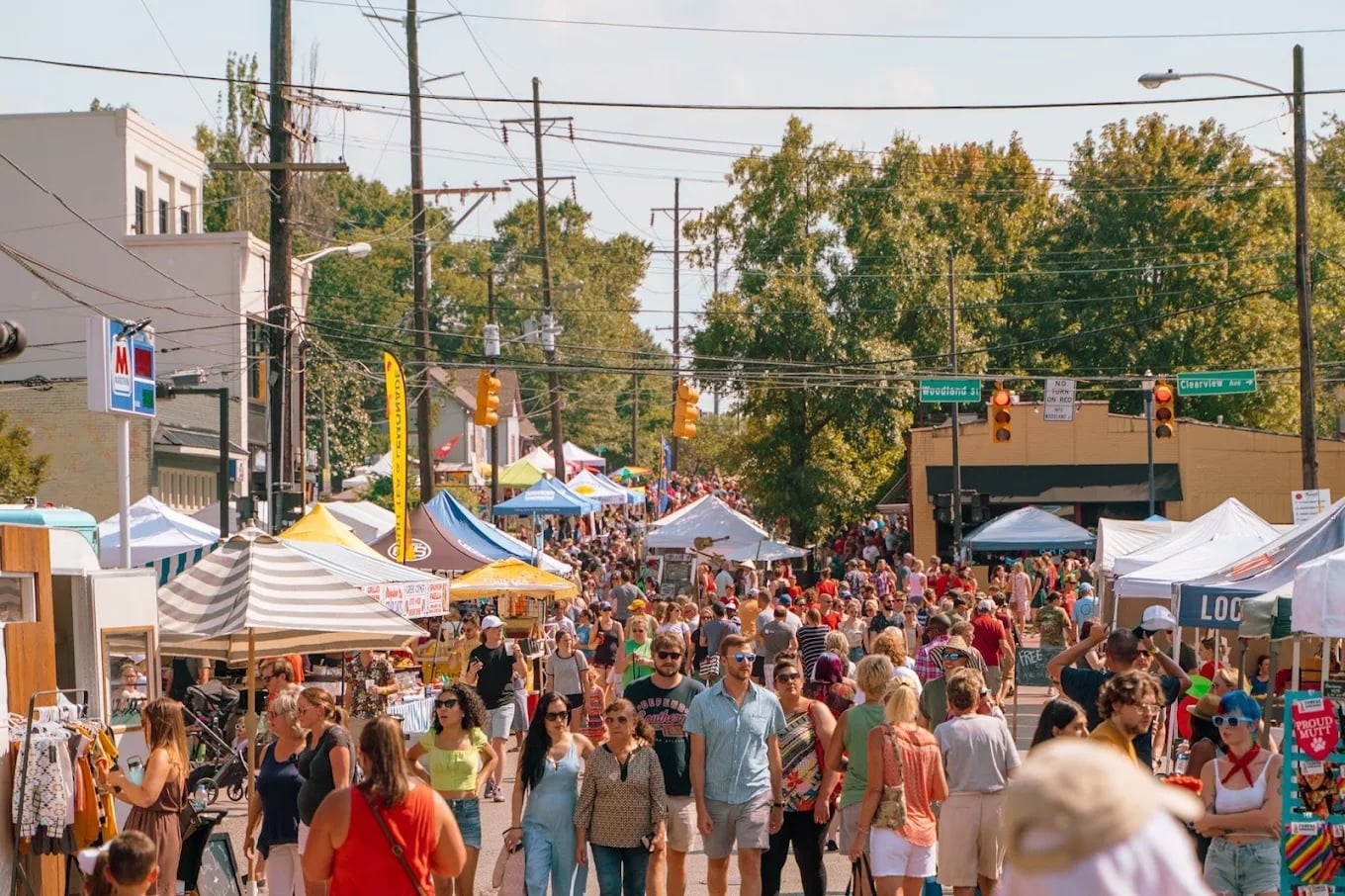 Crowds and vendor tents filling Woodland Street at Tomato Art Fest in Five Points, East Nashville